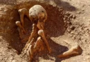 Children discover mysterious ancient skeleton sitting upright next to playground in France
